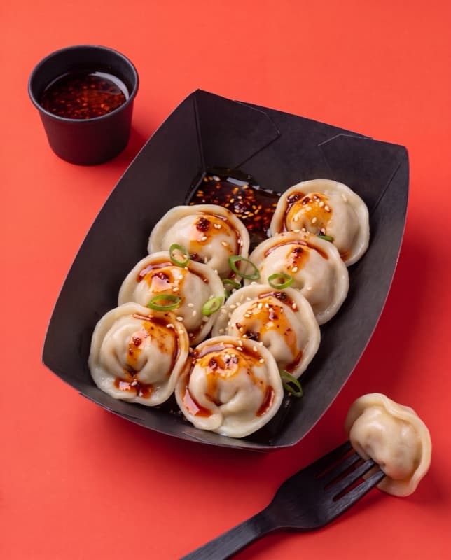 Shrimp pelmeni with chili oil and scallions