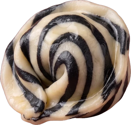 Handmade pelmeni with black-and-white zebra stripes and polka dots
